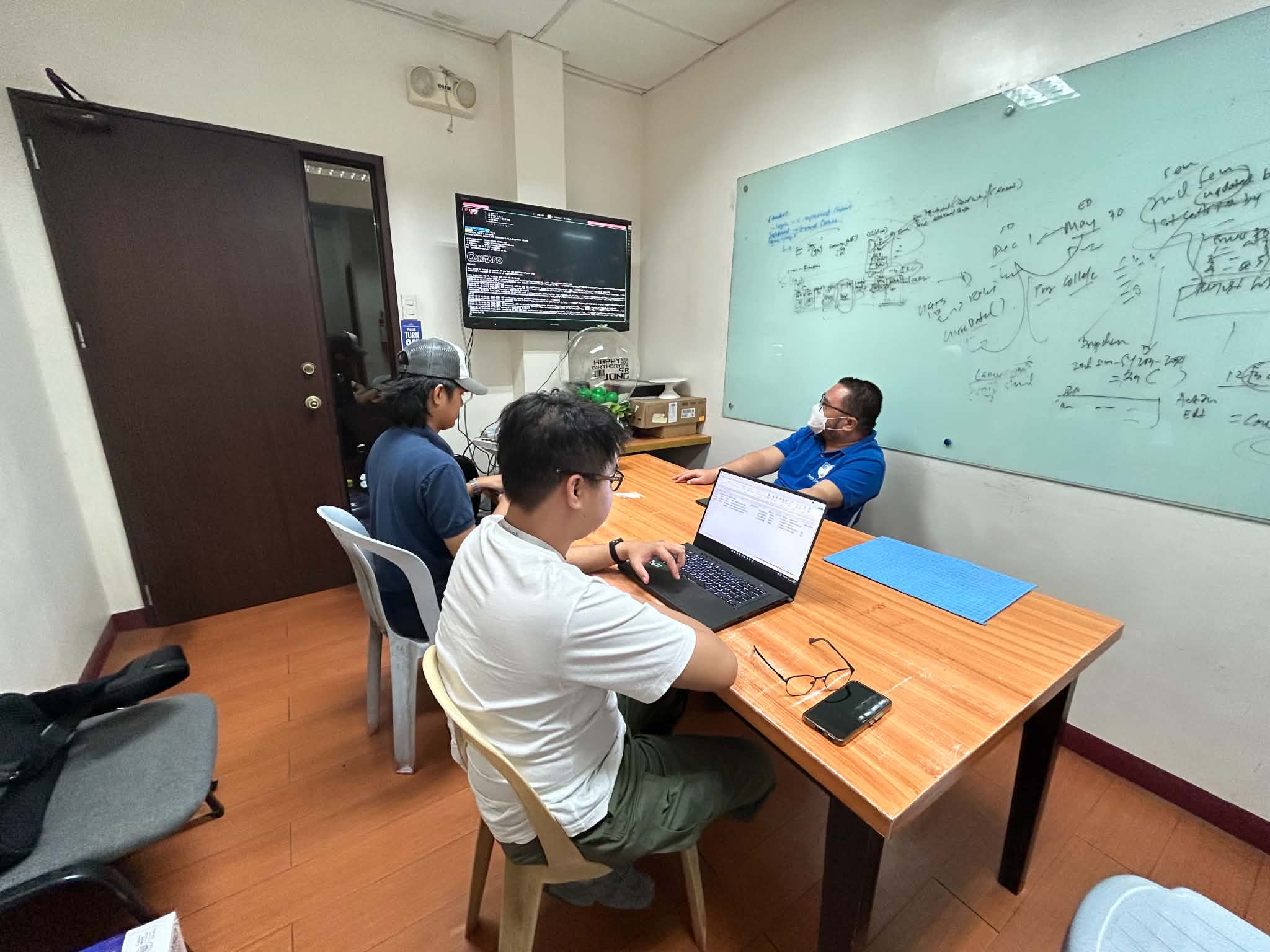 ClearTrack team reviewing the system with a university stakeholder