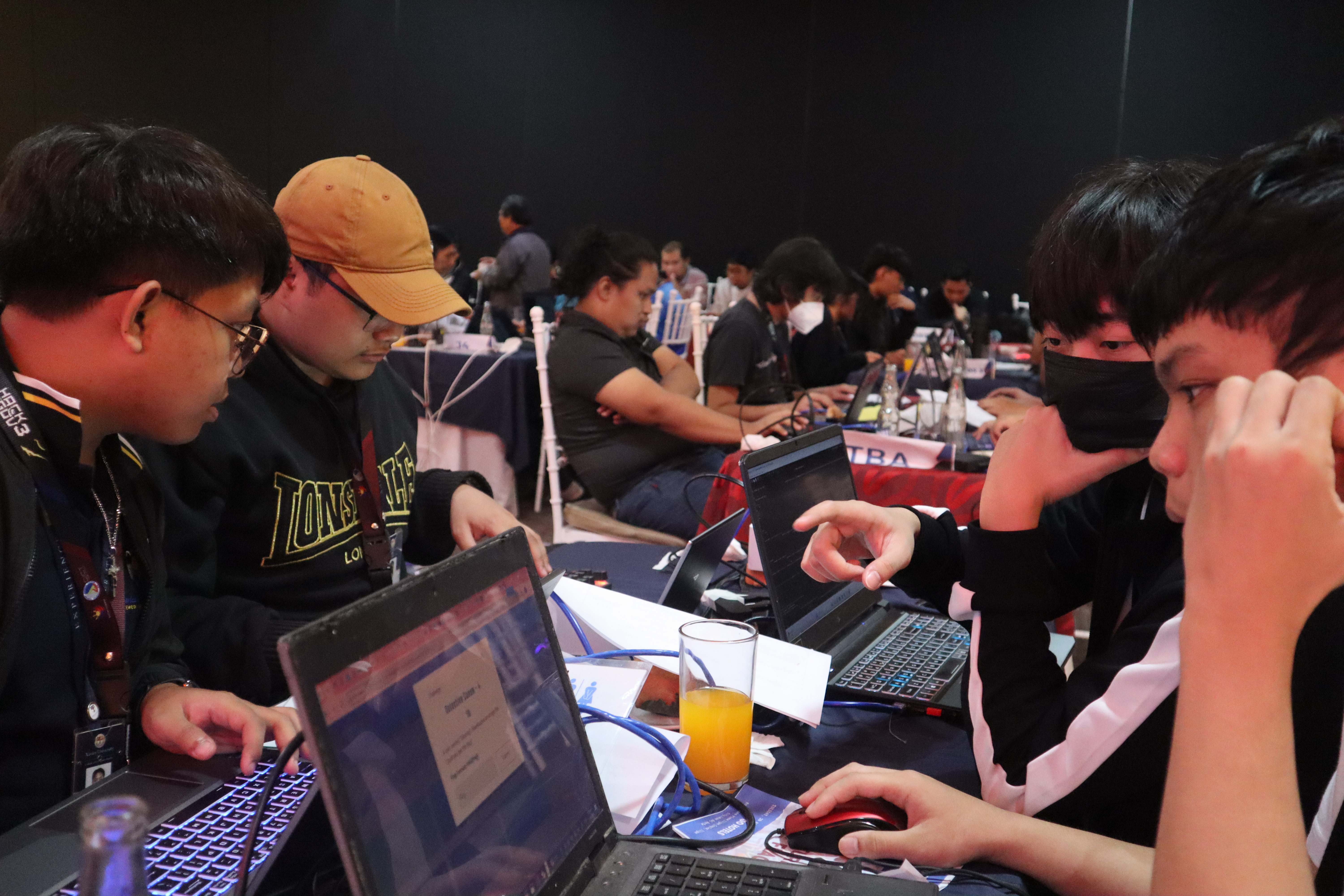 L33T Republic collaborating around laptops during Hack4Gov 3